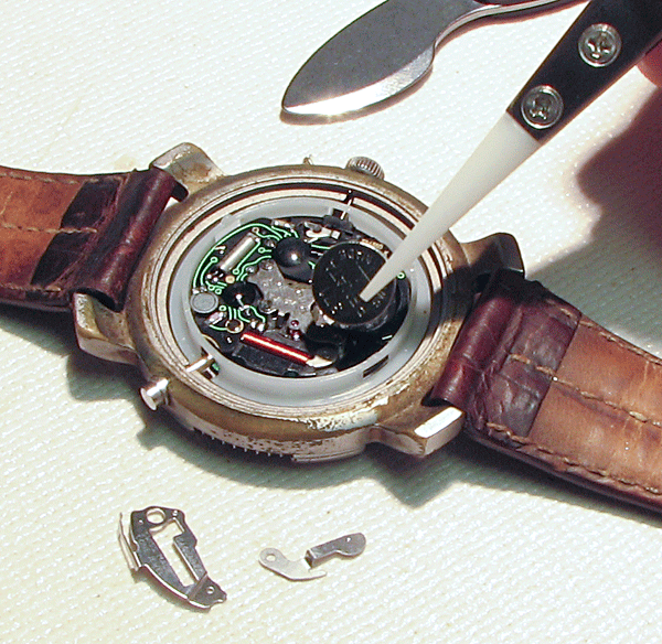 tweezers used to replace a watch battery